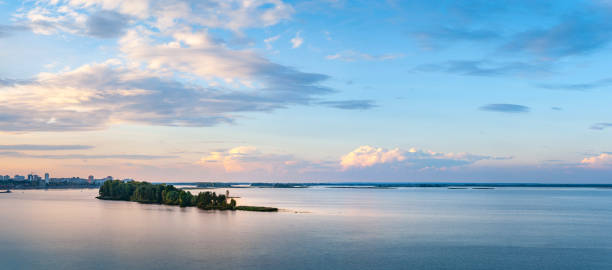 istock Sunset over the river. Landscape panoramic image of the sky and clouds over the river at sunset in the evening. Creative background for installation 2198378536