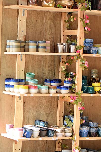 istock Colorful Ceramic Cups and Pots on Display Shelves 2198382798