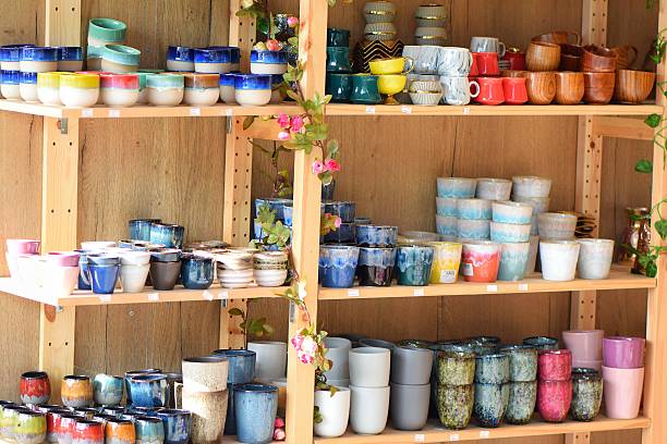istock Colorful Ceramic Cups and Pots on Display Shelves 2198382804