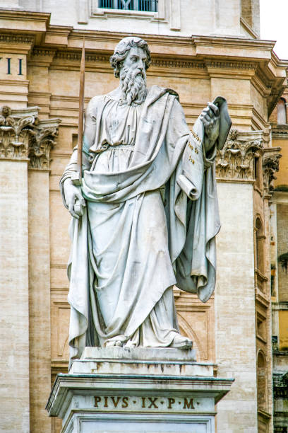 istock A statue of a man holding a book 2198385890