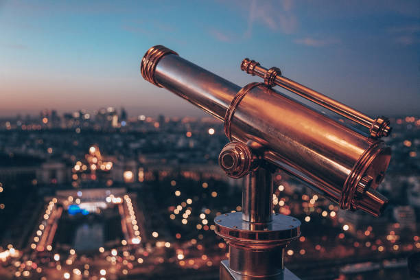 istock A telescope is pointed at the Paris city below 2198387149