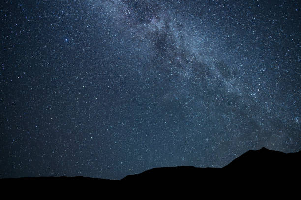 istock Beautiful bright Milky Way on the starry sky. Night ladscape. 2198387487