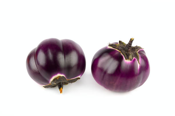 istock Eggplants or aubergine vegetables isolated on white. 2198390178