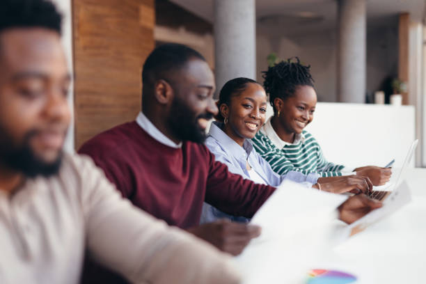 istock Young african professionals working together on a project 2198392891