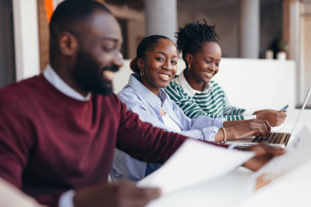 istock Young african professionals working together on a project 2198392900