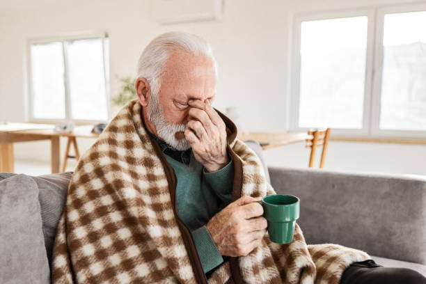 istock Senior Man Fighting a Cold with Hot Tea 2198393045