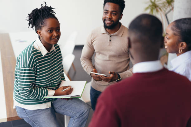 istock Young African businesspeople having a meeting in a modern office 2198393076