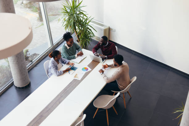 istock Business team discussing during a meeting in a modern office 2198395332
