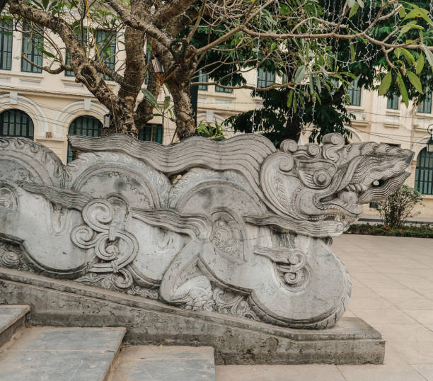 istock An Intricate Stone Dragon Sculpture is beautifully situated within a Historic Park setting 2198398750