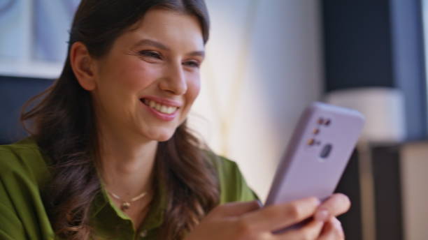 istock Business lady hands texting mobile phone in corporate workplace closeup. 2198398755