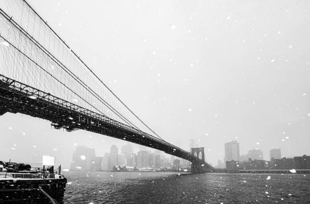 istock Brooklyn Bridge and East River in snow 2198400249