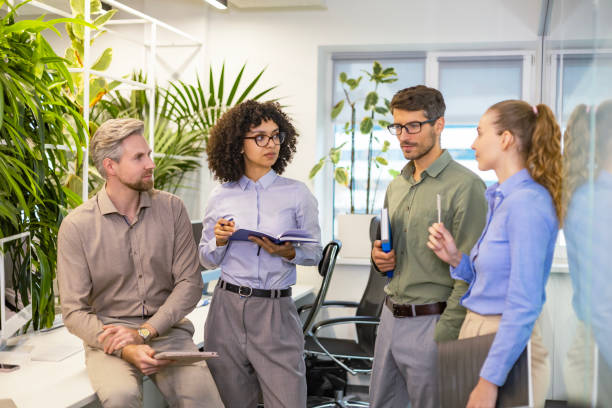 istock Startup business team on meeting in modern bright office interior and working on laptop 2198400643