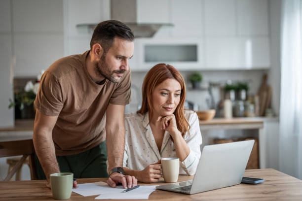 istock Couple sharing a productive workday at home 2198400822