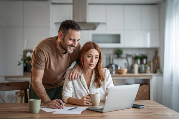 istock Couple sharing a productive workday at home 2198400836