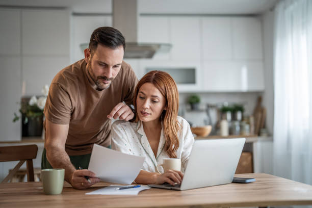 istock Couple sharing a productive workday at home 2198400856