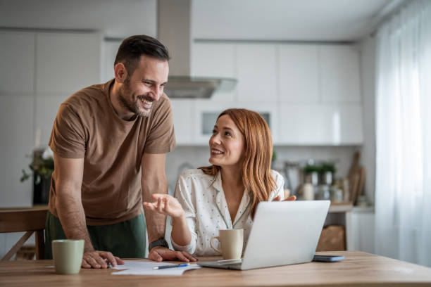 istock Couple sharing a productive workday at home 2198400859