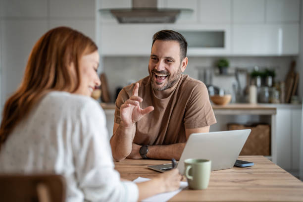 istock Couple sharing a productive work session at home 2198401114