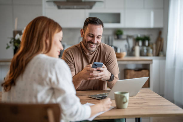 istock Partner sharing freelance details with their significant other on the phone 2198401218