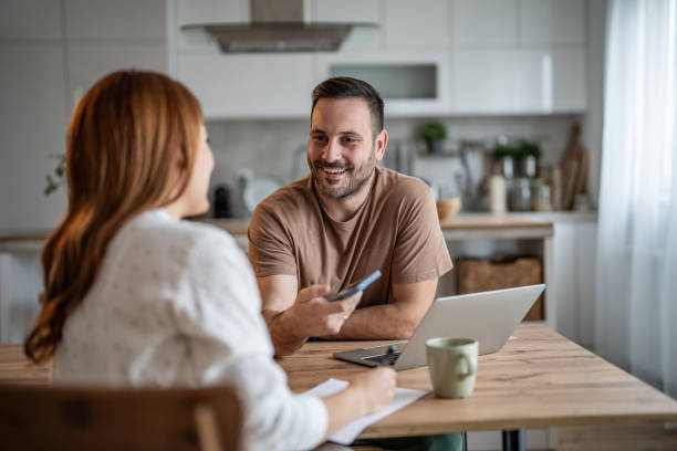 istock Partner sharing freelance details with their significant other on the phone 2198401222