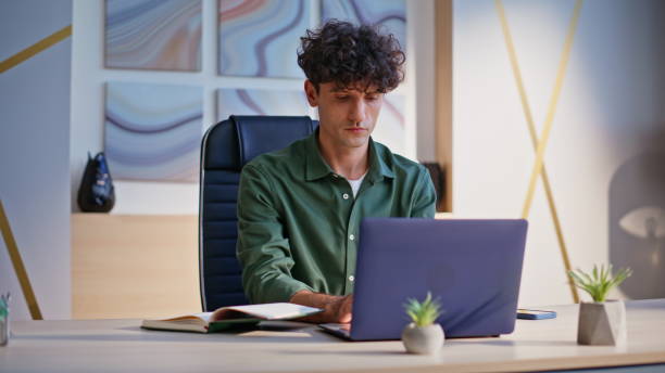 istock Focused copywriter working laptop at home workspace closeup. Serious manager 2198403153