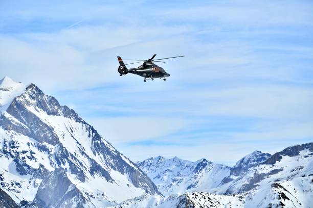 Private helicopter carrying skier tourist to Courchevel ski resort from Geneva airport, Courchevel ski resort airport, Rhône alps, French alps on 02/07/2025