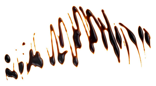 istock Sweet chocolate syrup isolated on a white background, top view. Melted chocolate sauce. 2198403447
