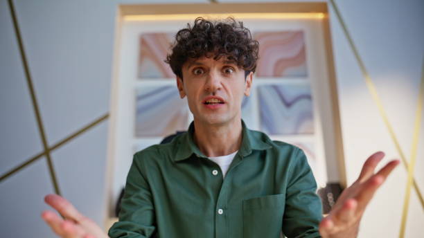 istock Businessman quarrelling video call discussing work problem closeup pov view. 2198403862