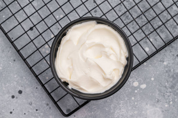 istock Healthy Fresh greek yogurt in a bowl. grey background. top view 2198404706