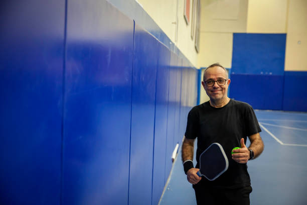 istock pickleball paddle is in male pickleball player hand another hand is doing OK horizontal pickleball still 2198406790