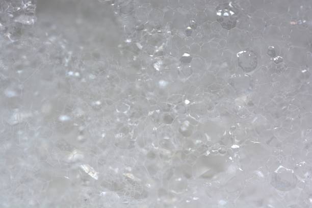 istock Bubbly soap foam background. Soap foam closeup. White foam backdrop. 2198407516