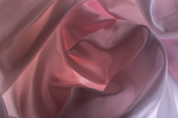 Close-up image of beautiful green silk satin fabric used for home decoration.