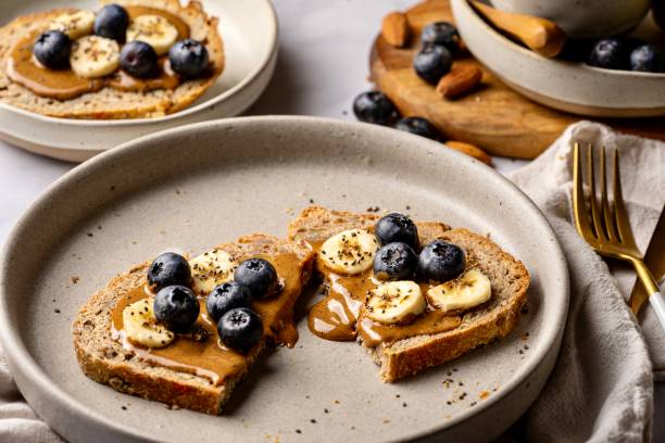 istock Sourdough bread with fruit and almond butter dripping 2198410092