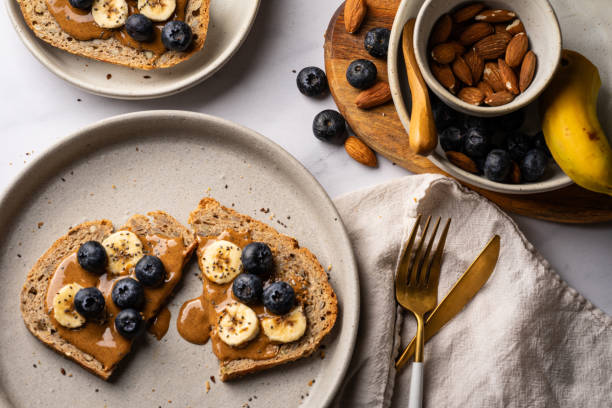 Sourdough bread open sandwich with almond butter and fruit.