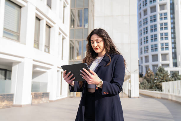 istock business woman using smart phone 2198413866