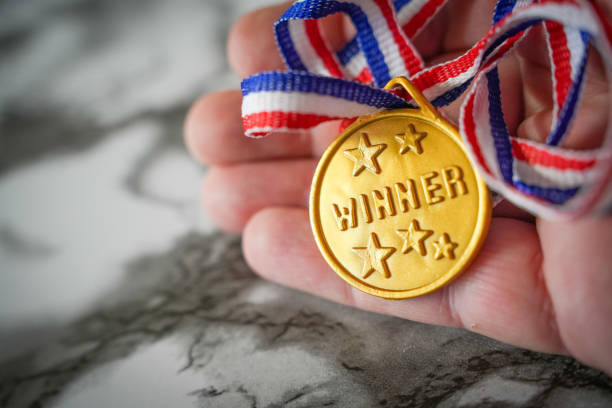 gold medal against yellow background