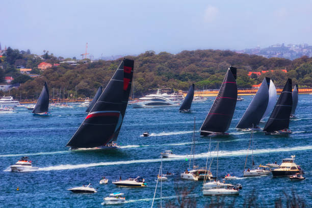 Sydney, Australia - 26 Dec 2023: Sydney Hobart Yacht race regatta start on Sydney Hobart with super maxi yachts in the lead.