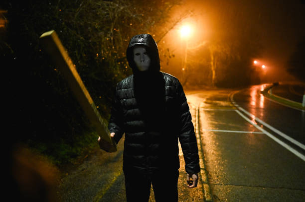 istock Criminal in action on street. 2198423718
