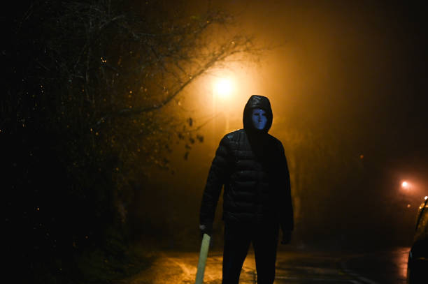 istock spooky hooded figure in fog 2198423763