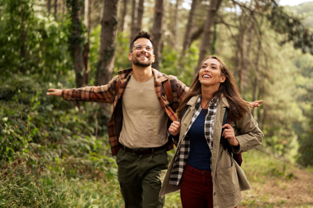 istock Beautiful young couple exploring nature 2198435673