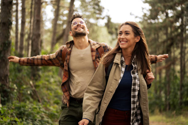istock Beautiful young couple exploring nature 2198435730