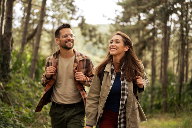 istock Beautiful young couple exploring nature 2198435734