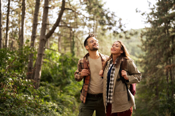 istock Beautiful young couple exploring nature 2198435848