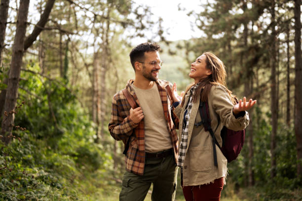 istock Beautiful young couple exploring nature 2198436432