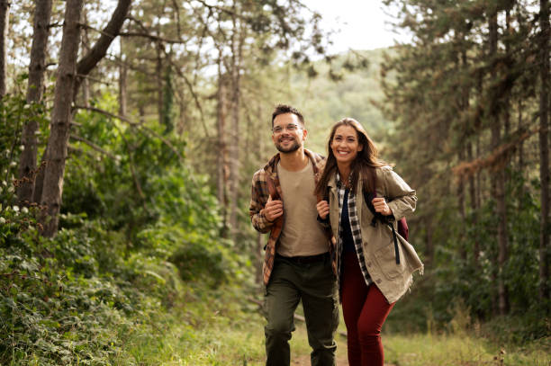 istock Beautiful young couple exploring nature 2198436433