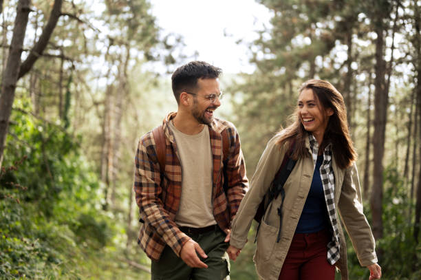 istock Beautiful young couple exploring nature 2198436543