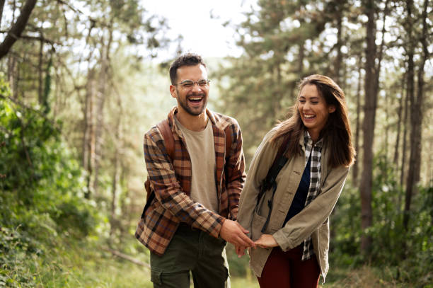 istock Beautiful young couple exploring nature 2198436548