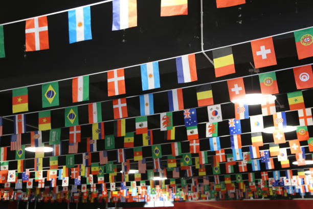 istock A large wall decorated with flags of different countries, hanging from the ceiling in rows. 2198437782