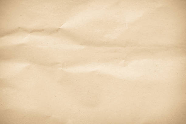 istock Old paper vintage texture surface for background. Recycle pale brown paper crumpled texture, Cream color recycled kraft paper texture blank with copy space for text. 2198438875