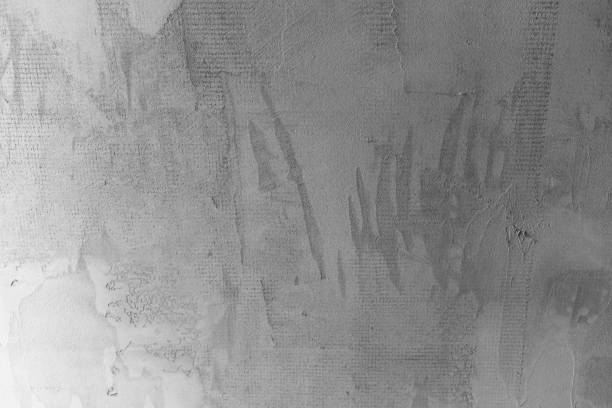 istock Wall with textured concrete surface and faint markings in a modern setting 2198439184