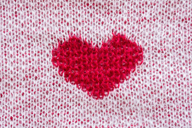 Heart symbol on fabric texture background